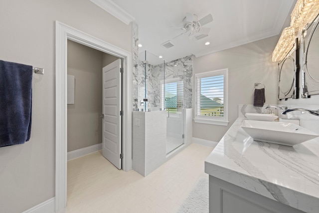 bathroom featuring a marble finish shower, ornamental molding, baseboards, a sink, and a ceiling fan