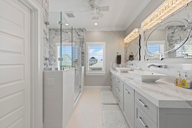 full bath with a sink, a marble finish shower, visible vents, ceiling fan, and double vanity