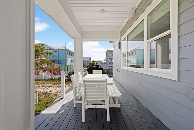 wooden deck featuring outdoor dining area and area for grilling