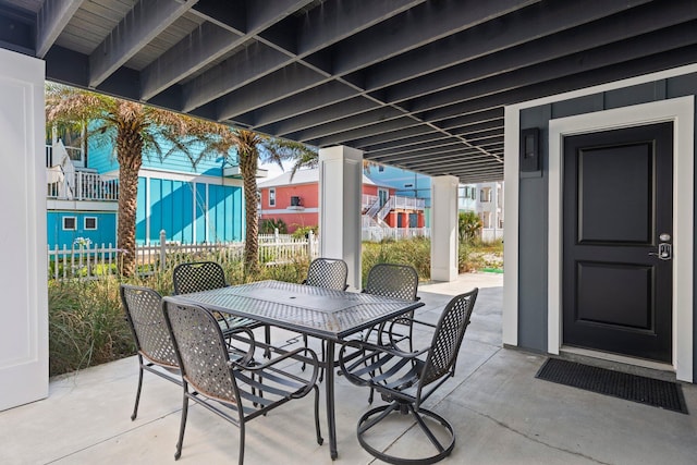 view of patio / terrace with outdoor dining area and fence