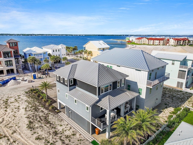 bird's eye view featuring a residential view and a water view