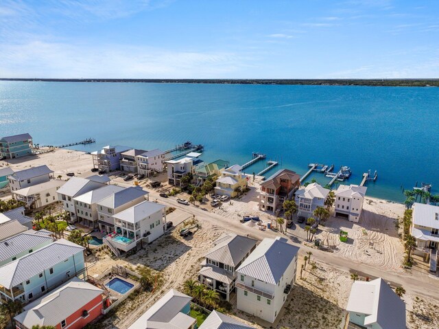 birds eye view of property featuring a water view and a residential view