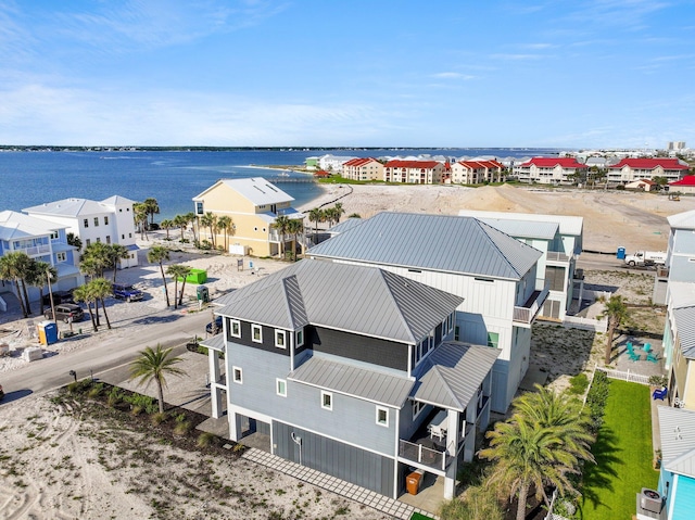 birds eye view of property featuring a residential view and a water view