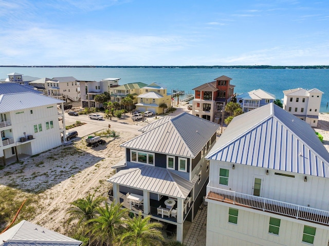 birds eye view of property with a residential view and a water view