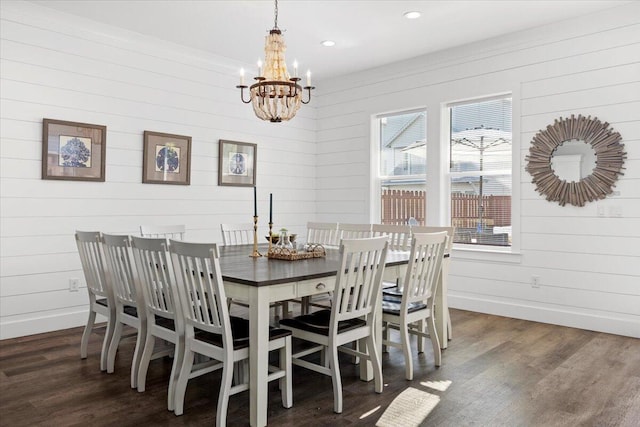 dining room with dark wood-type flooring, a notable chandelier, baseboards, and recessed lighting