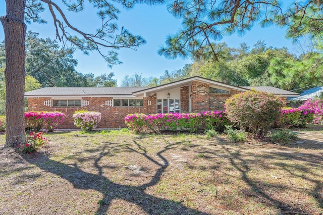 view of front of property featuring brick siding