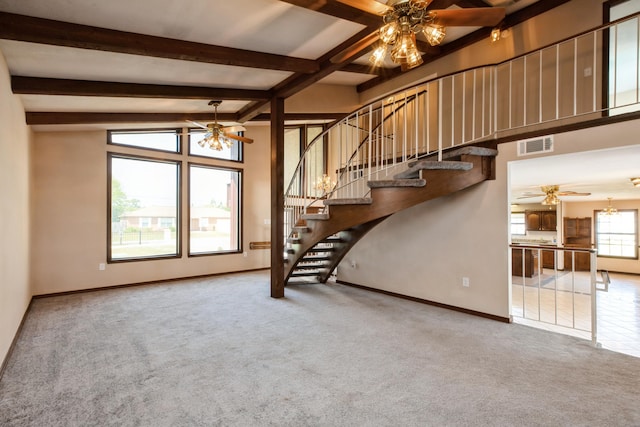 2116 Vizcaya Dr, Navarre, FL 32566 - unfurnished living room featuring ceiling fan with notable chandelier, carpet, beamed ceiling, and visible vents