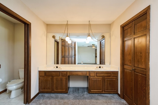 2116 Vizcaya Dr, Navarre, FL 32566 - full bathroom featuring baseboards, double vanity, a sink, and toilet