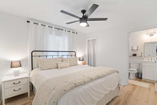 11 Beachside Dr Unit 913, Santa Rosa Beach, FL 32459 - bedroom featuring a sink, ensuite bath, ceiling fan, and light wood-style flooring