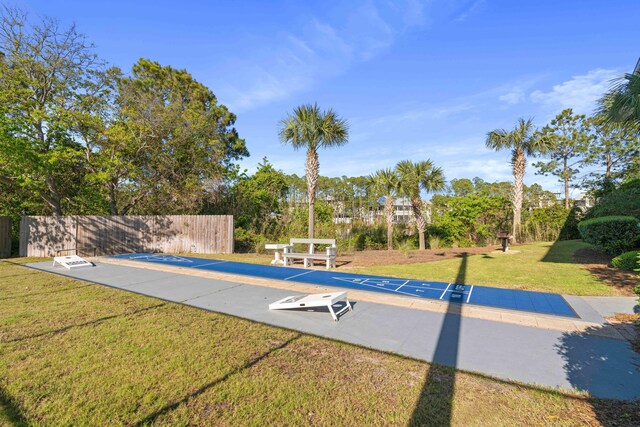 11 Beachside Dr Unit 913, Santa Rosa Beach, FL 32459 - view of pool with a lawn, fence, and shuffleboard