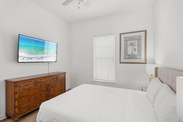 2221 Crystal Cove Ln Unit 2221, Miramar Beach, FL 32550 - bedroom with a ceiling fan, baseboards, and light wood-style flooring
