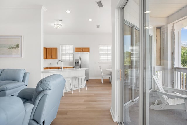 2221 Crystal Cove Ln Unit 2221, Miramar Beach, FL 32550 - living area with visible vents, recessed lighting, a healthy amount of sunlight, and light wood-type flooring