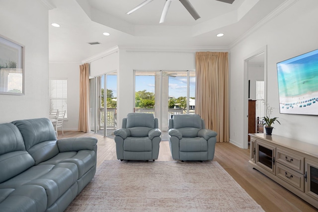 2221 Crystal Cove Ln Unit 2221, Miramar Beach, FL 32550 - living area featuring visible vents, light wood-style floors, ceiling fan, recessed lighting, and a tray ceiling