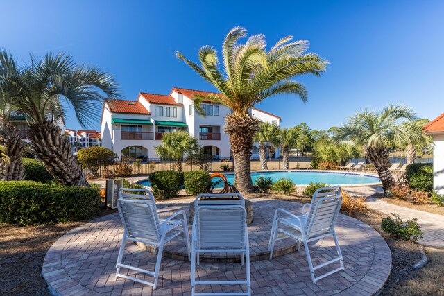 8730 Thomas Dr # 1203C, Panama City Beach, FL 32408 - view of patio / terrace with a community pool