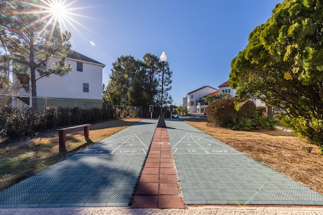 8730 Thomas Dr # 1203C, Panama City Beach, FL 32408 - view of community featuring shuffleboard and fence