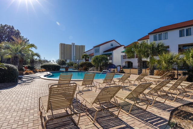 8730 Thomas Dr # 1203C, Panama City Beach, FL 32408 - community pool with fence and a patio