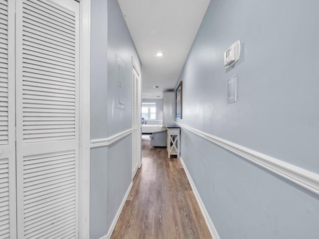8730 Thomas Dr # 1203C, Panama City Beach, FL 32408 - hall featuring baseboards and wood finished floors