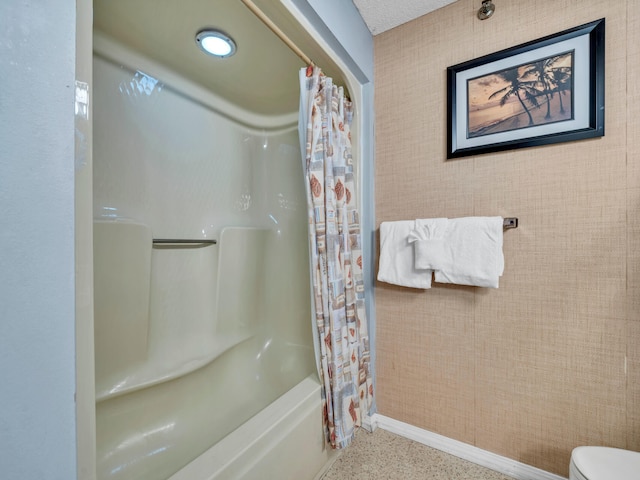 8730 Thomas Dr # 1203C, Panama City Beach, FL 32408 - full bathroom featuring baseboards, toilet, speckled floor, and shower / bathtub combination with curtain