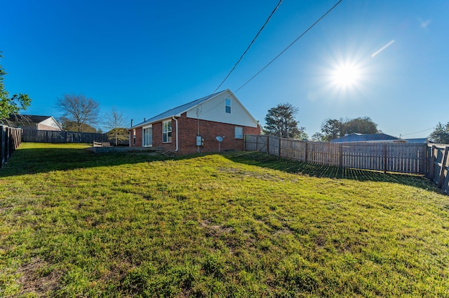 view of yard featuring a fenced backyard