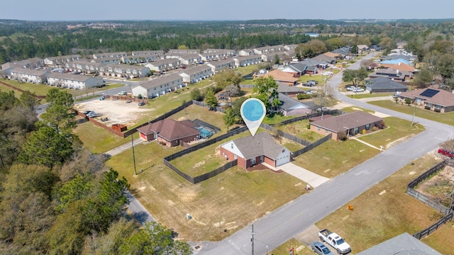 birds eye view of property with a residential view