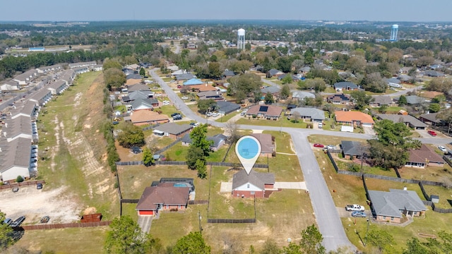 birds eye view of property with a residential view