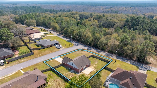 bird's eye view featuring a residential view and a forest view