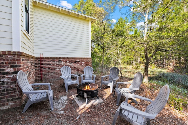 view of patio / terrace featuring a fire pit