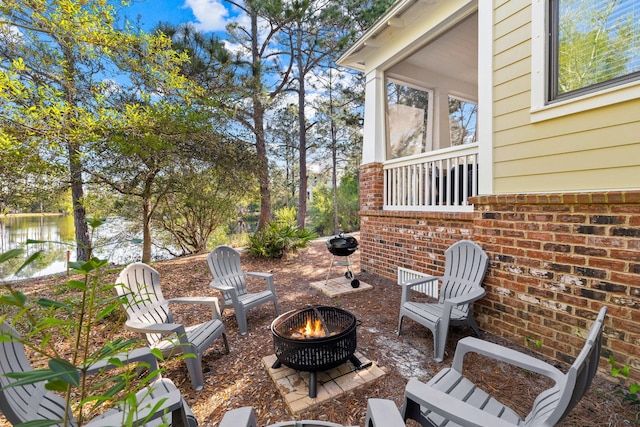 view of patio with an outdoor fire pit