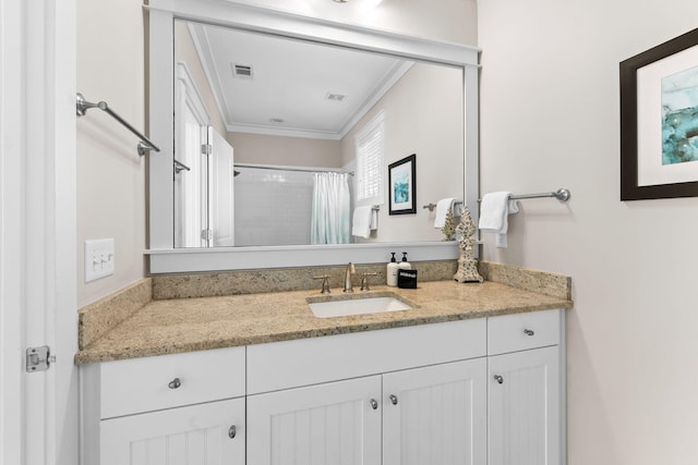 bathroom featuring a shower with curtain, vanity, ornamental molding, and visible vents