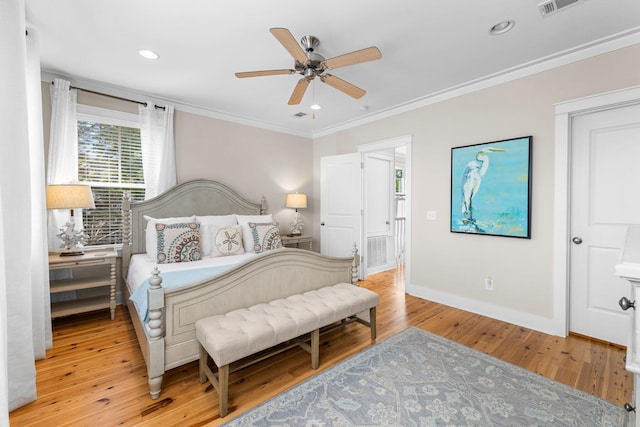 bedroom with baseboards, ornamental molding, ceiling fan, recessed lighting, and light wood-style floors