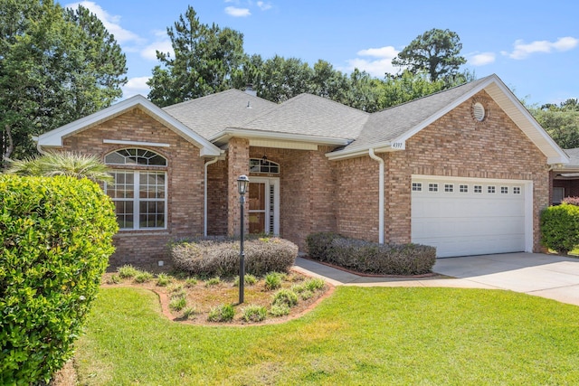 4397 Vardon Way, Niceville, FL 32578 - view of front of home with roof with shingles, an attached garage, a front lawn, driveway, and brick siding