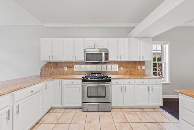 4397 Vardon Way, Niceville, FL 32578 - kitchen featuring appliances with stainless steel finishes, decorative backsplash, white cabinetry, and ornamental molding