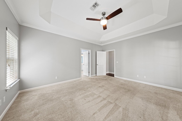 4397 Vardon Way, Niceville, FL 32578 - carpeted empty room featuring a tray ceiling, ceiling fan, ornamental molding, and baseboards
