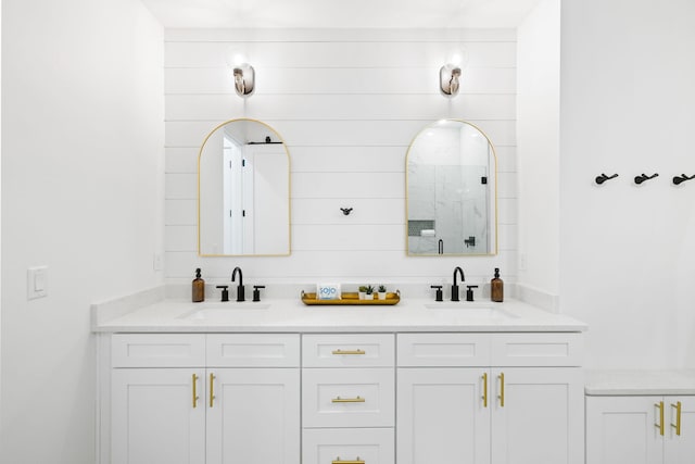 bathroom featuring double vanity and a sink