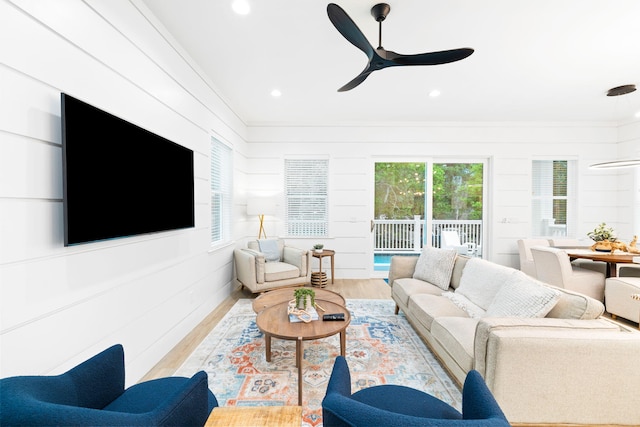 living area featuring wood finished floors, recessed lighting, and a ceiling fan
