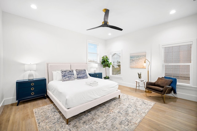 bedroom with baseboards, ceiling fan, recessed lighting, and light wood-style floors