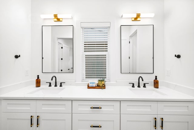 full bath with double vanity and a sink