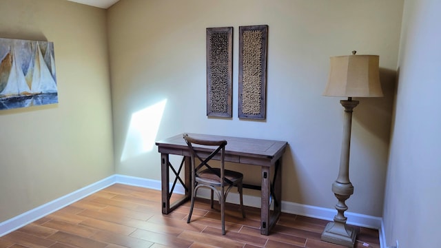 office space featuring baseboards and wood tiled floor