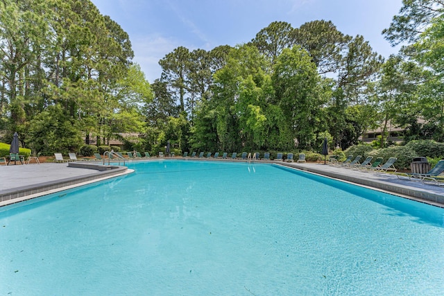 community pool with a patio area