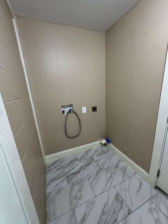 laundry room featuring hookup for an electric dryer, baseboards, marble finish floor, laundry area, and washer hookup