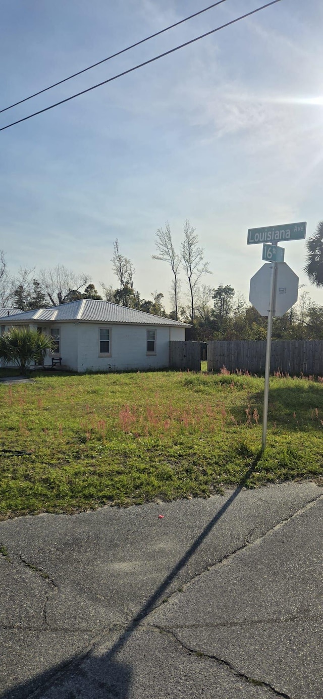 view of side of home with fence