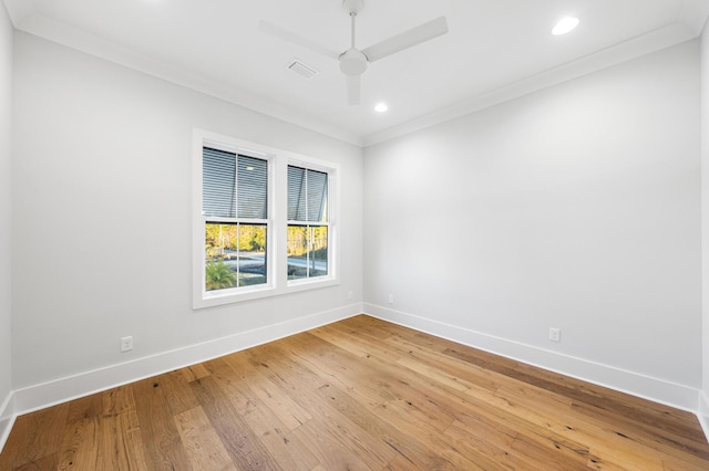 unfurnished room featuring crown molding, light wood-type flooring, baseboards, visible vents, and recessed lighting