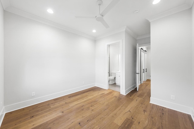 unfurnished bedroom featuring recessed lighting, crown molding, light wood-style floors, and baseboards