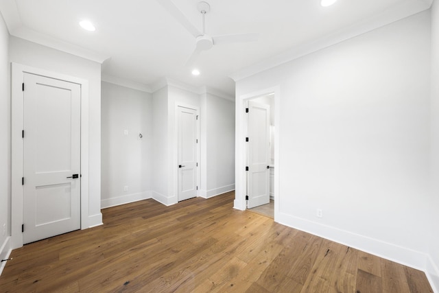 unfurnished room with recessed lighting, ornamental molding, baseboards, and wood finished floors