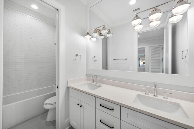 full bathroom with visible vents, a sink, toilet, and double vanity
