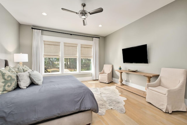 bedroom with baseboards, wood finished floors, recessed lighting, and a ceiling fan