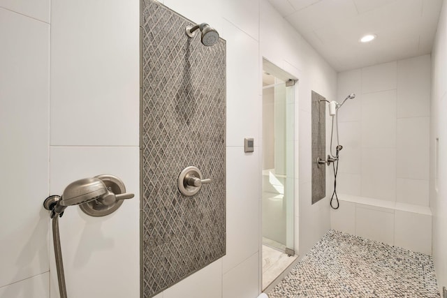 bathroom featuring a stall shower and recessed lighting