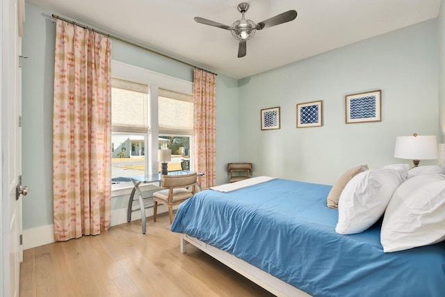 bedroom featuring wood finished floors and a ceiling fan