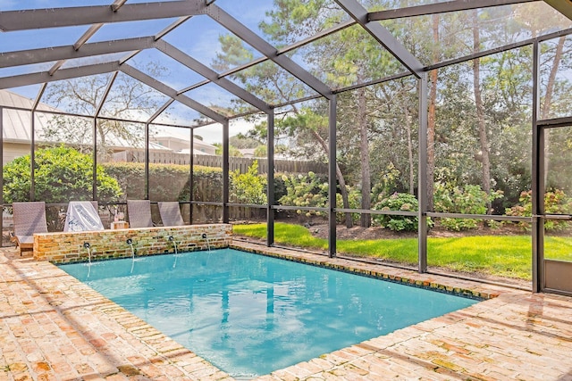 outdoor pool with a lanai and a patio