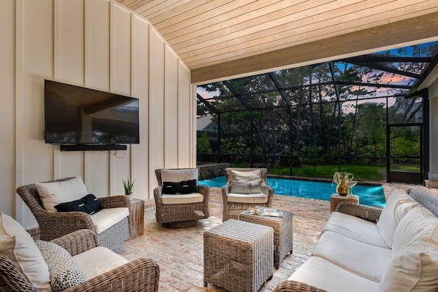 view of patio with an outdoor hangout area, an outdoor pool, and glass enclosure